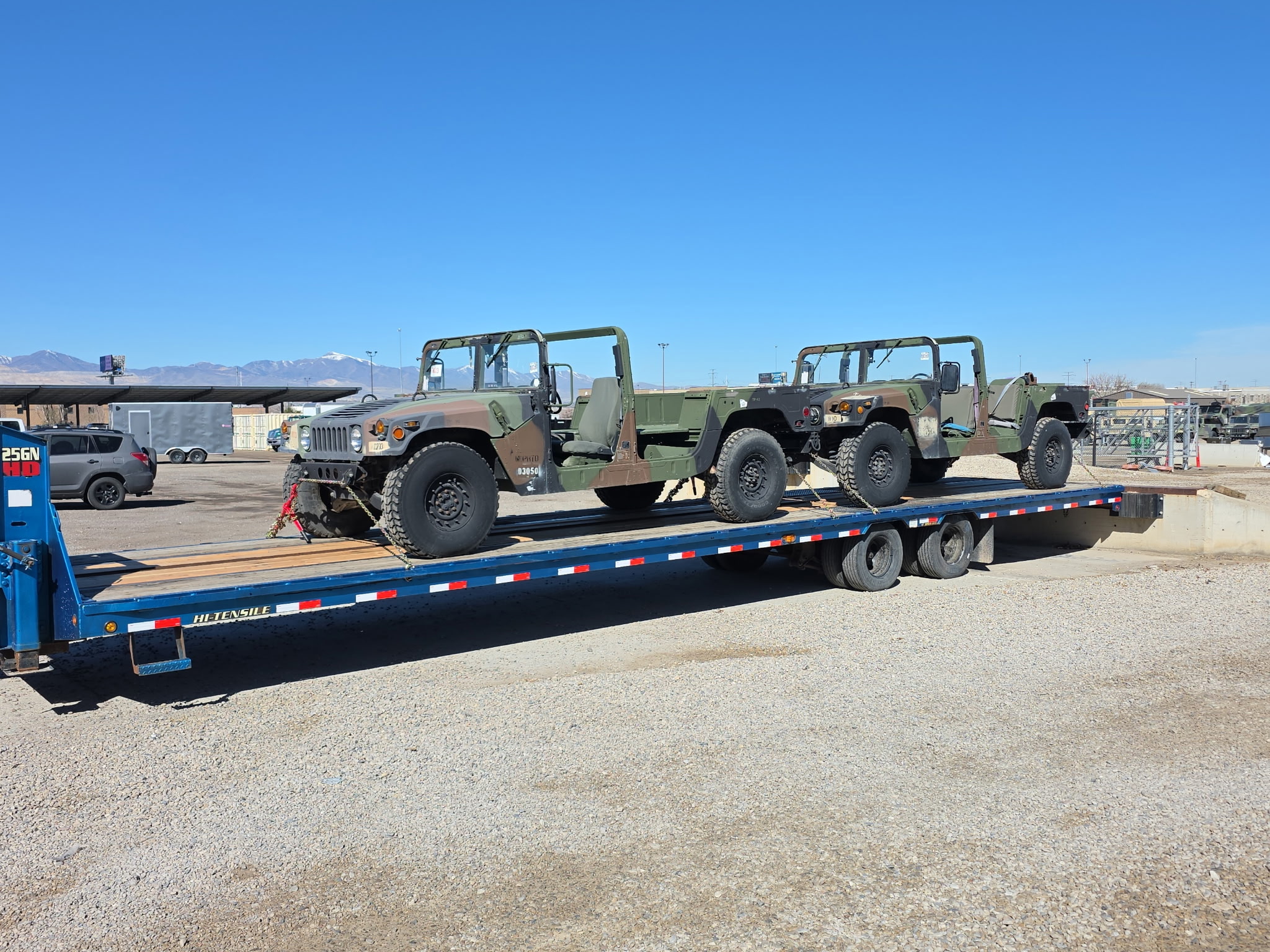 Military Humvees on flatbed trailer