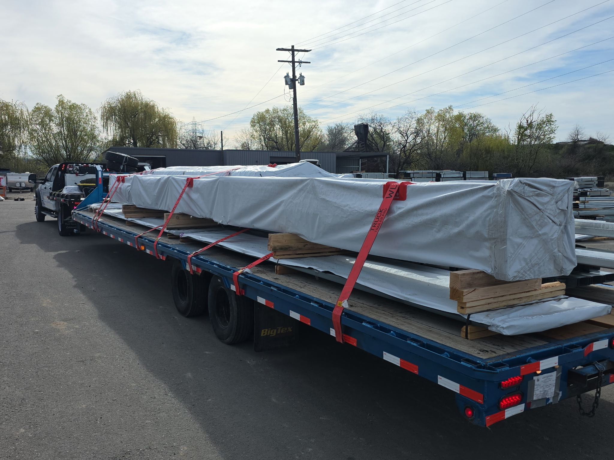 Wrapped freight cargo on hotshot trailer